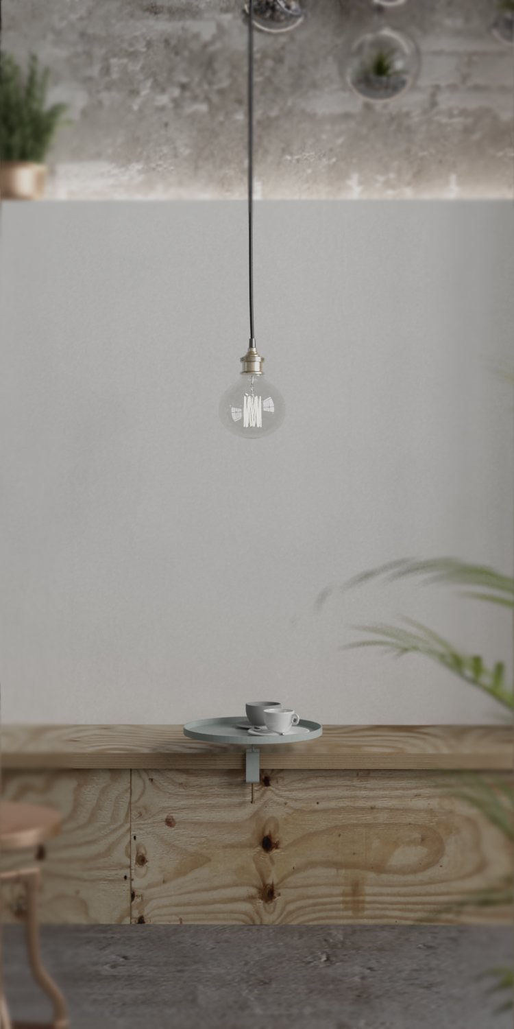 Una lámpara colgante con bombilla sin pantalla, sobre una mesa con tazas, en un ambiente minimalista con paredes blancas, madera y plantas.