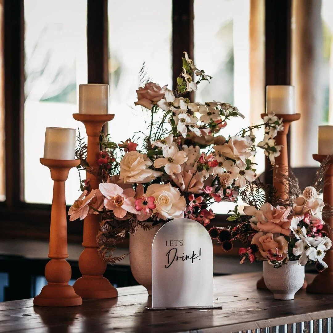 When it comes to making an impact, make sure you don't leave any areas untouched. 
You've no doubt thought of your table styling but have you thought of an entrance feature, bar feature, cake table feature? 
Pictured here is a stunning bar feature