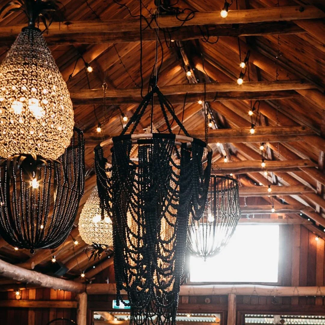 Does your venue have high ceilings? 
High ceilings create a sense of grandeur though they can reduce the impact of the table stying.
Close the gap between table and ceiling with a ceiling installation. 
We have so many lighting options to suit all