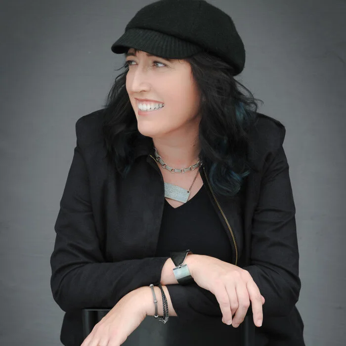 Me, wearing a hat, wearing a sarcastic grin...and clothes.