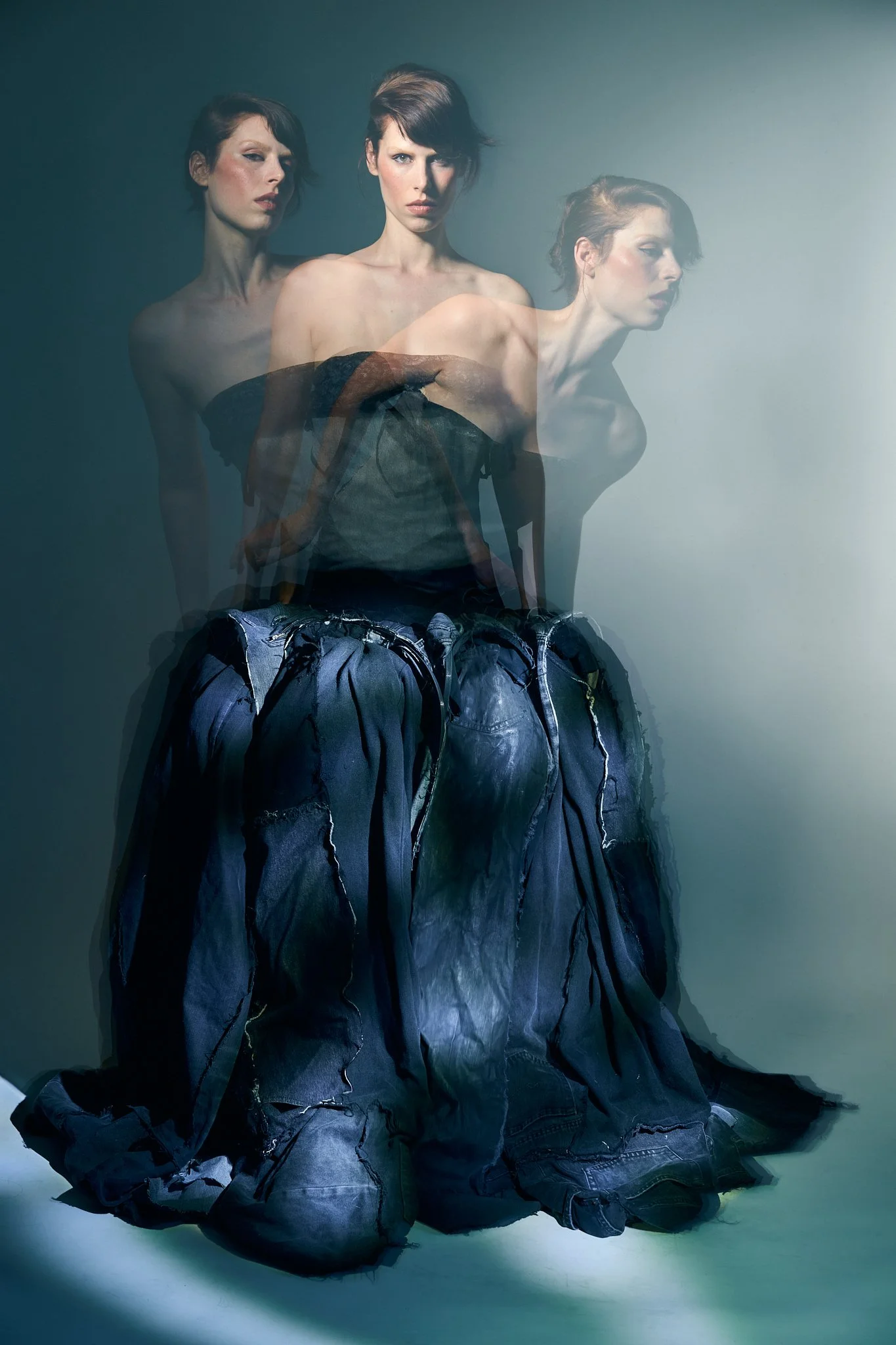Artistic editorial composition showing three multiple exposures of the same model in dynamic poses, emphasizing movement and flowing fabrics with a motion blur effect.⁠
