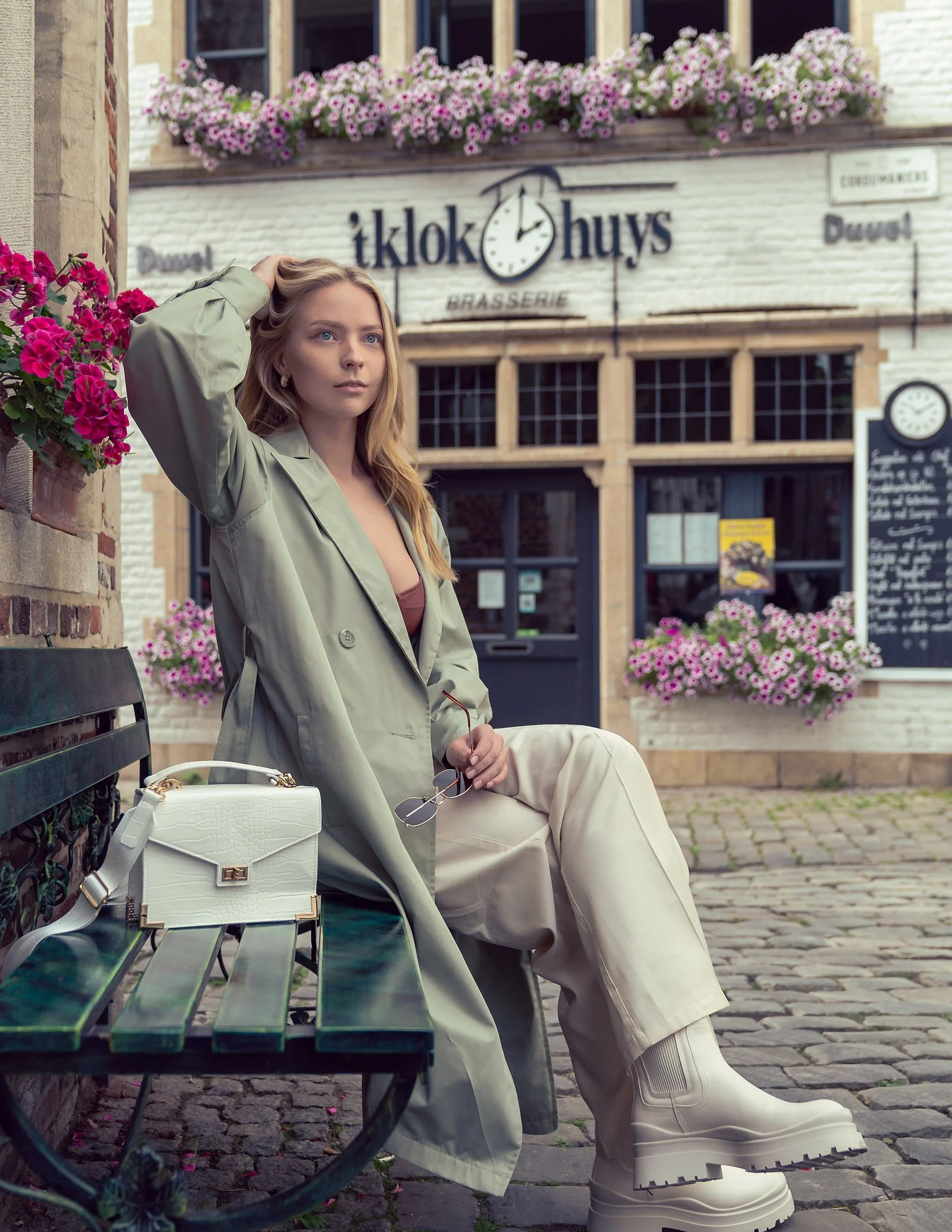 Chic solo portrait on cobblestone streets of Ghent, Belgium — luxury travel photoshoot with timeless styling and cinematic composition.