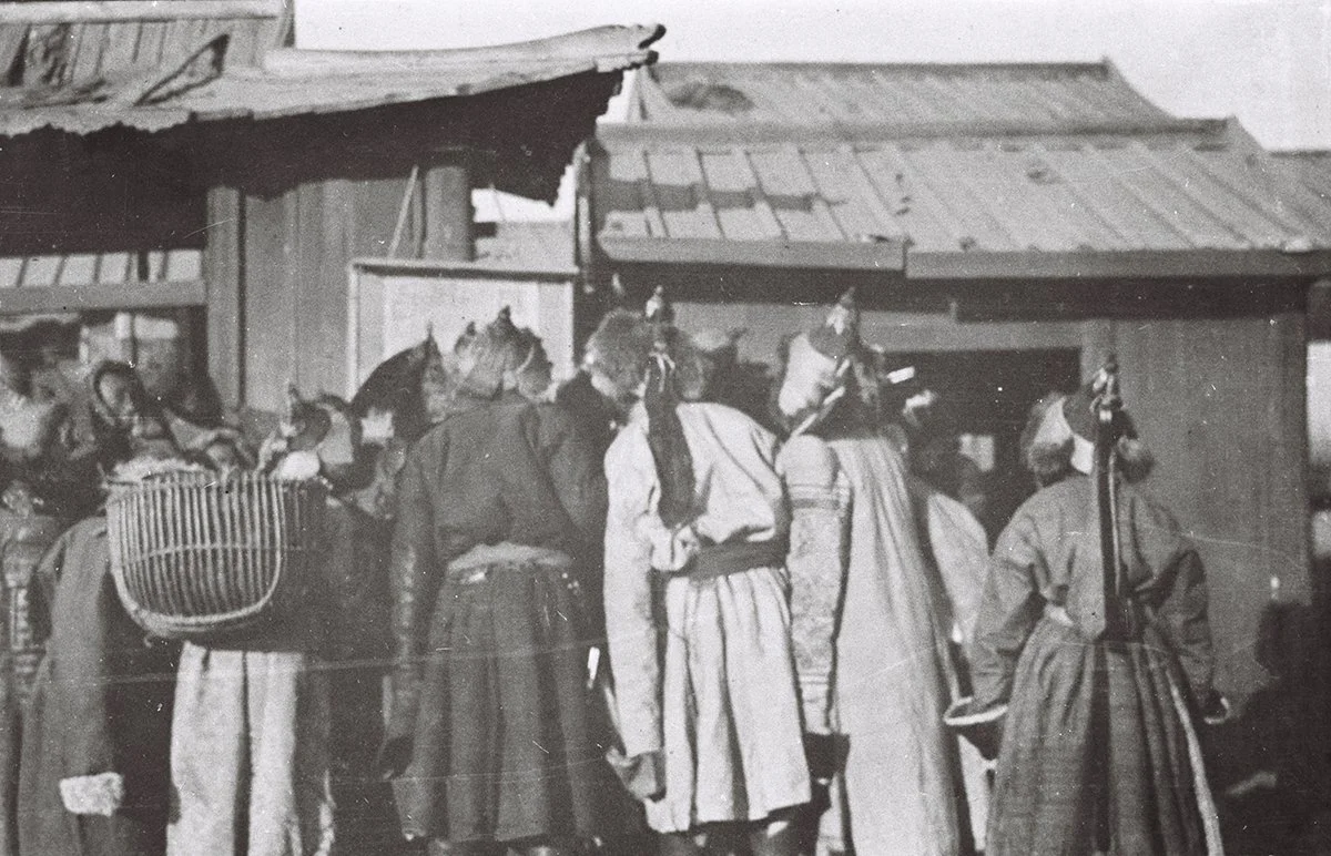  Mongols crowding around a posted proclamation Urga 1911/TAR 