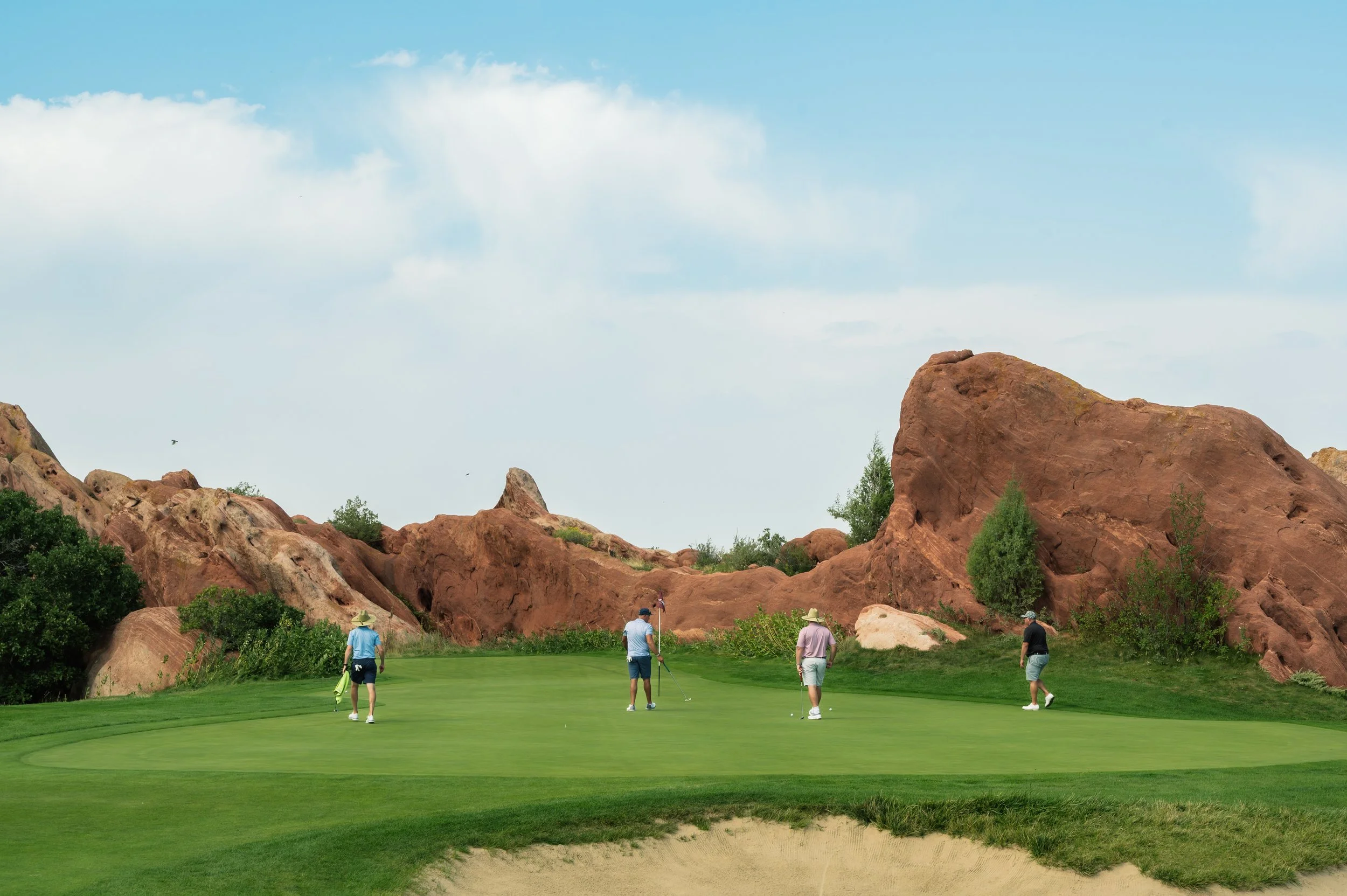 Team on Putting Green w Rocks.jpg