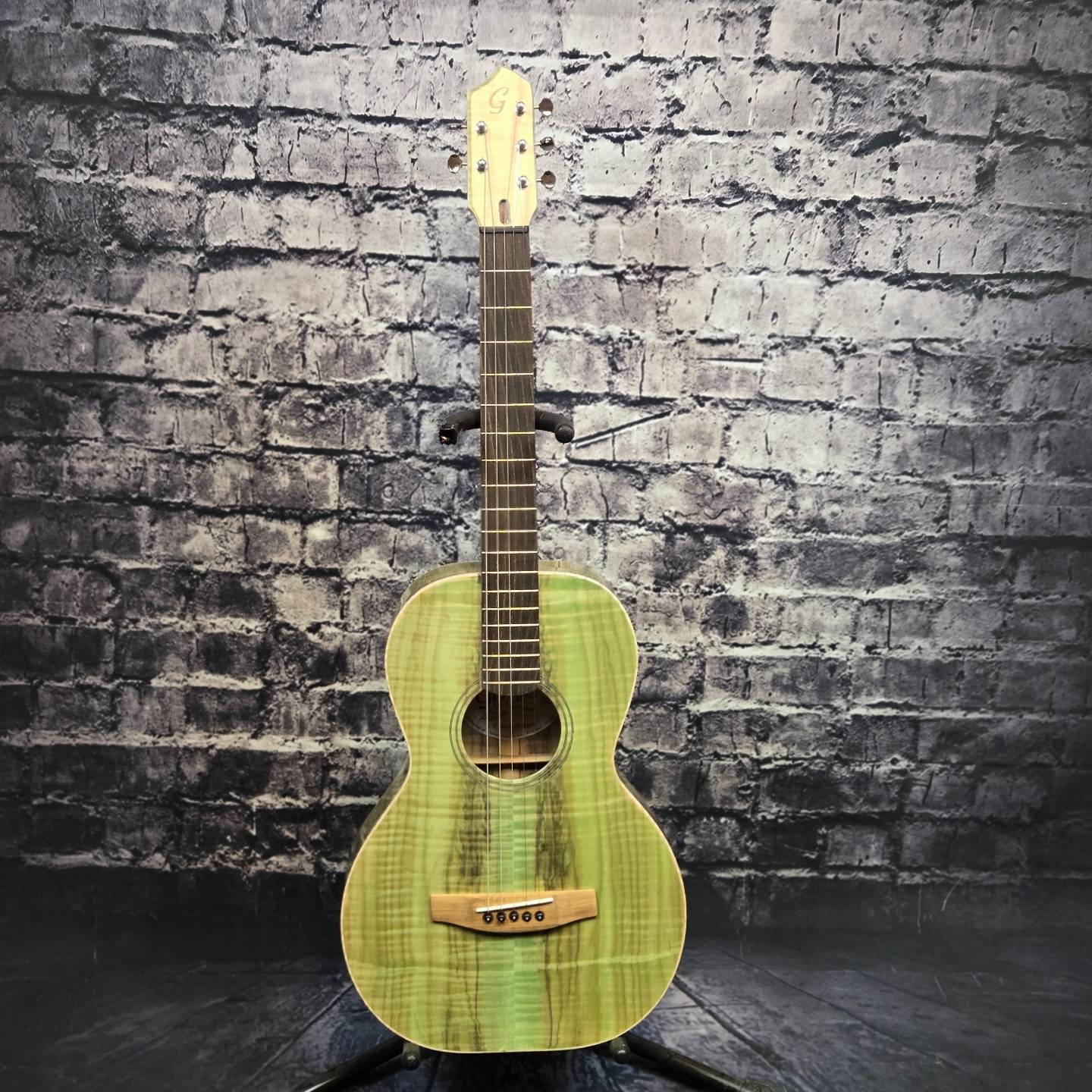 A total experiment in both colour and design. The idea came from a @jacobcollier video. Alternate tuning 5 string acoustic. This Gilmore Parlor Suze is constructed of locally harvested Laurel Leaf Willow. Spanish Cedar neck with an ebonized locally h