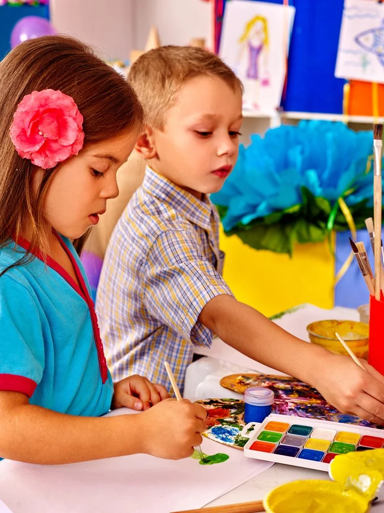 Boy and girl painting