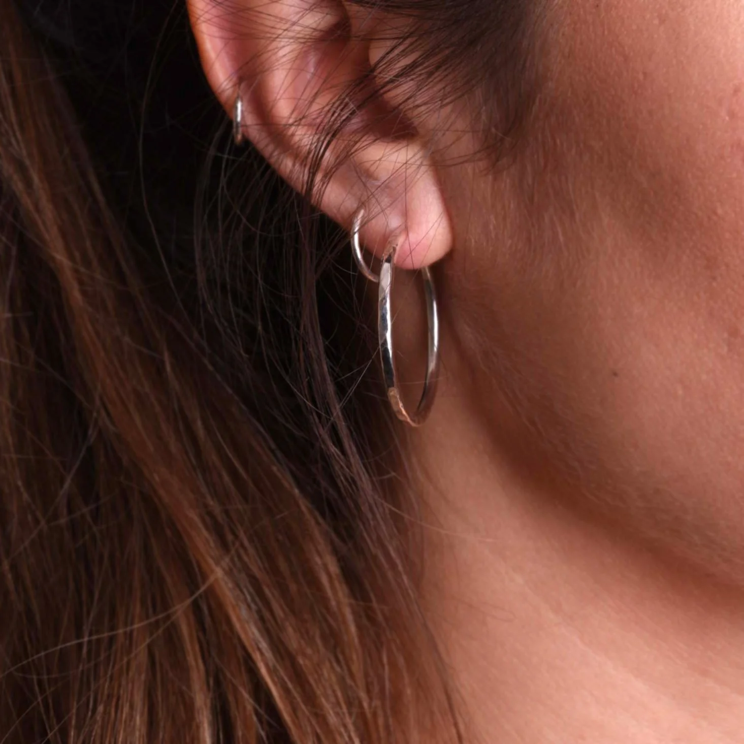Hammered Hoops Silver on Ear.jpg