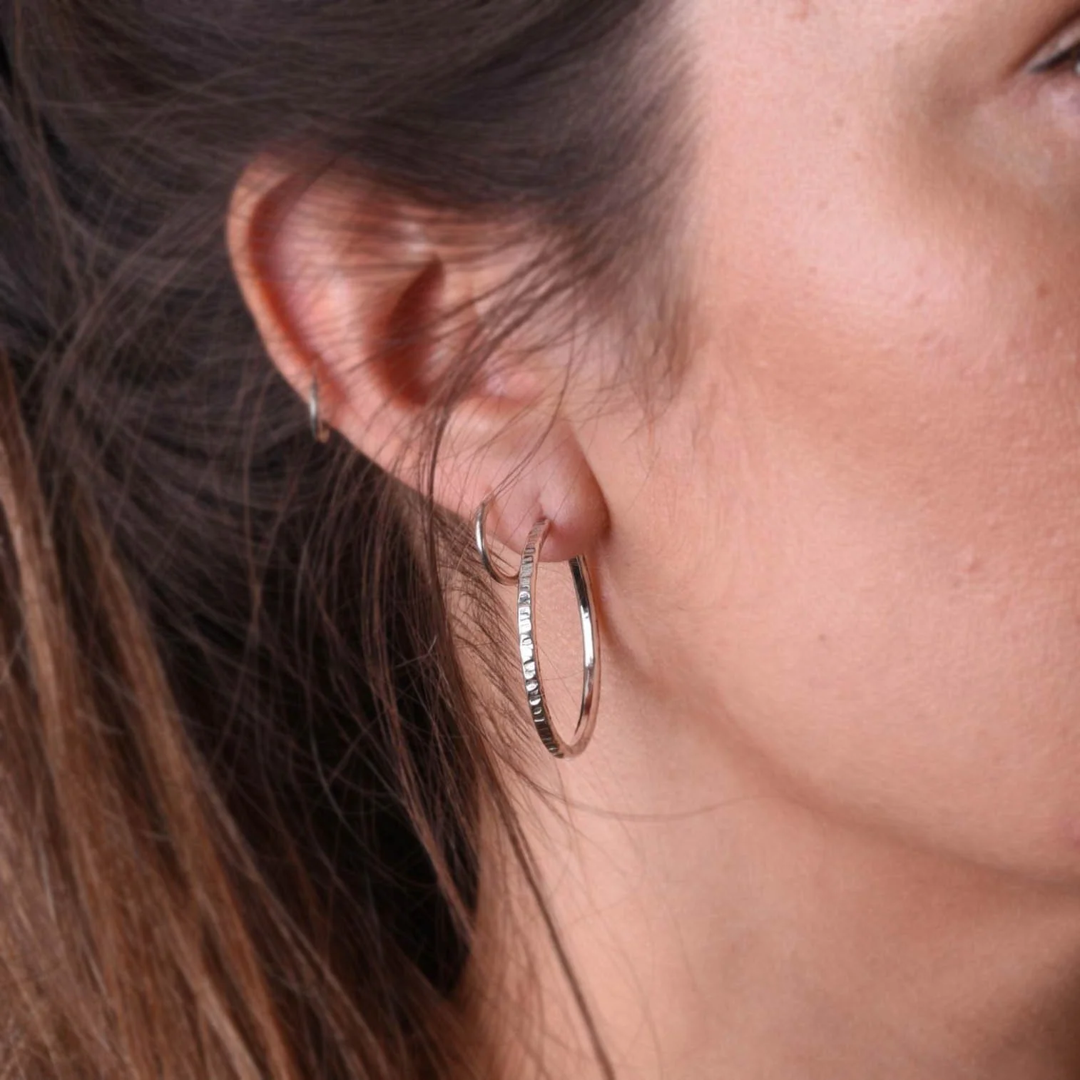 Linear Hoops silver in ear.jpg