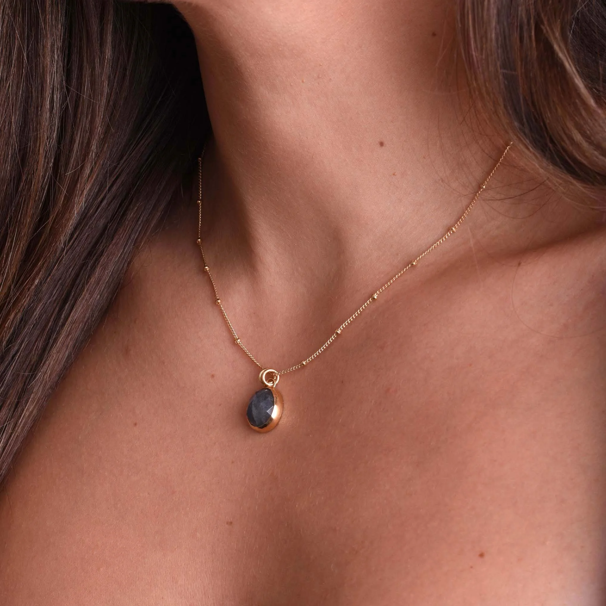 Facted Labradorite Pendant on Model 2.jpg