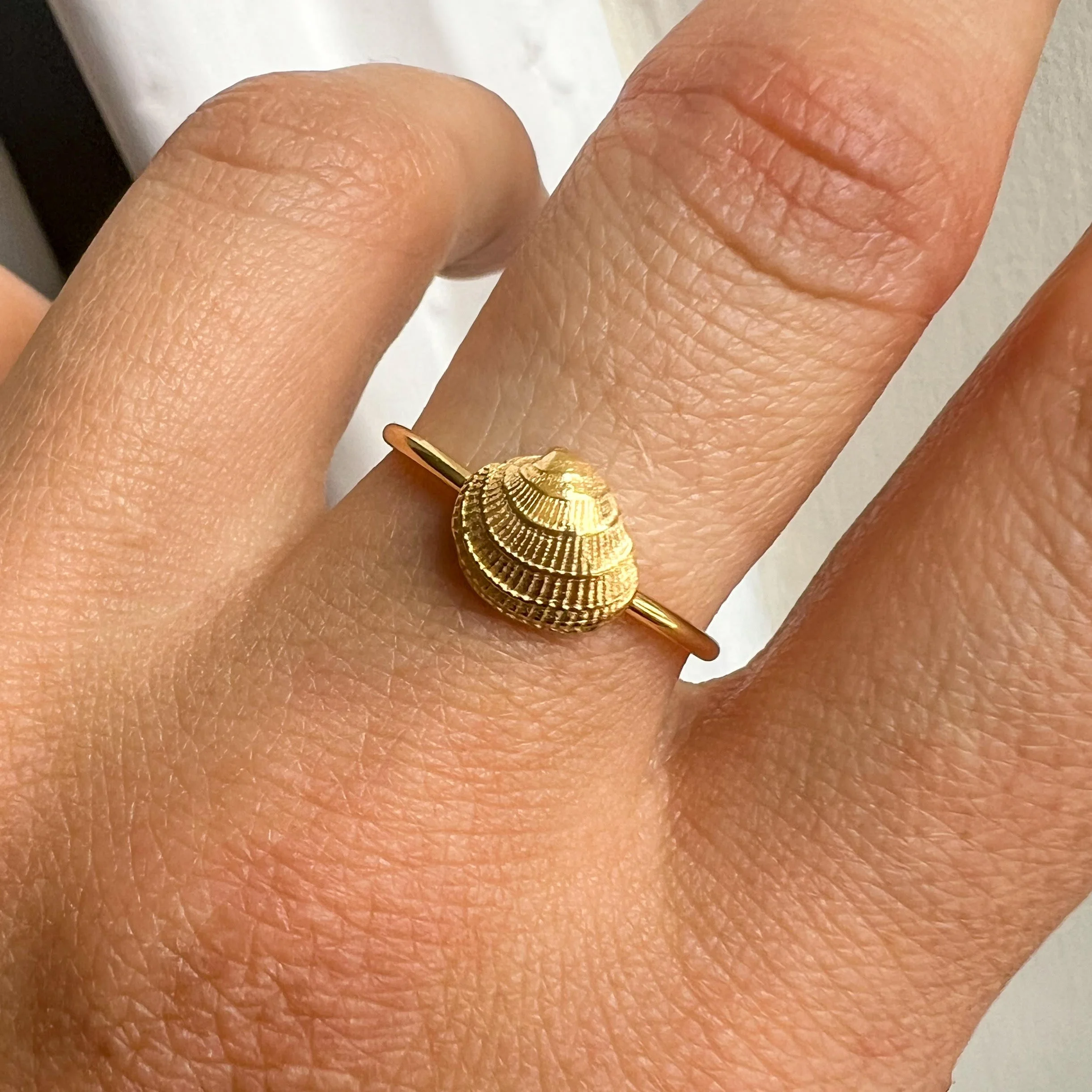 Mini Shell Ring Gold on Finger.jpg