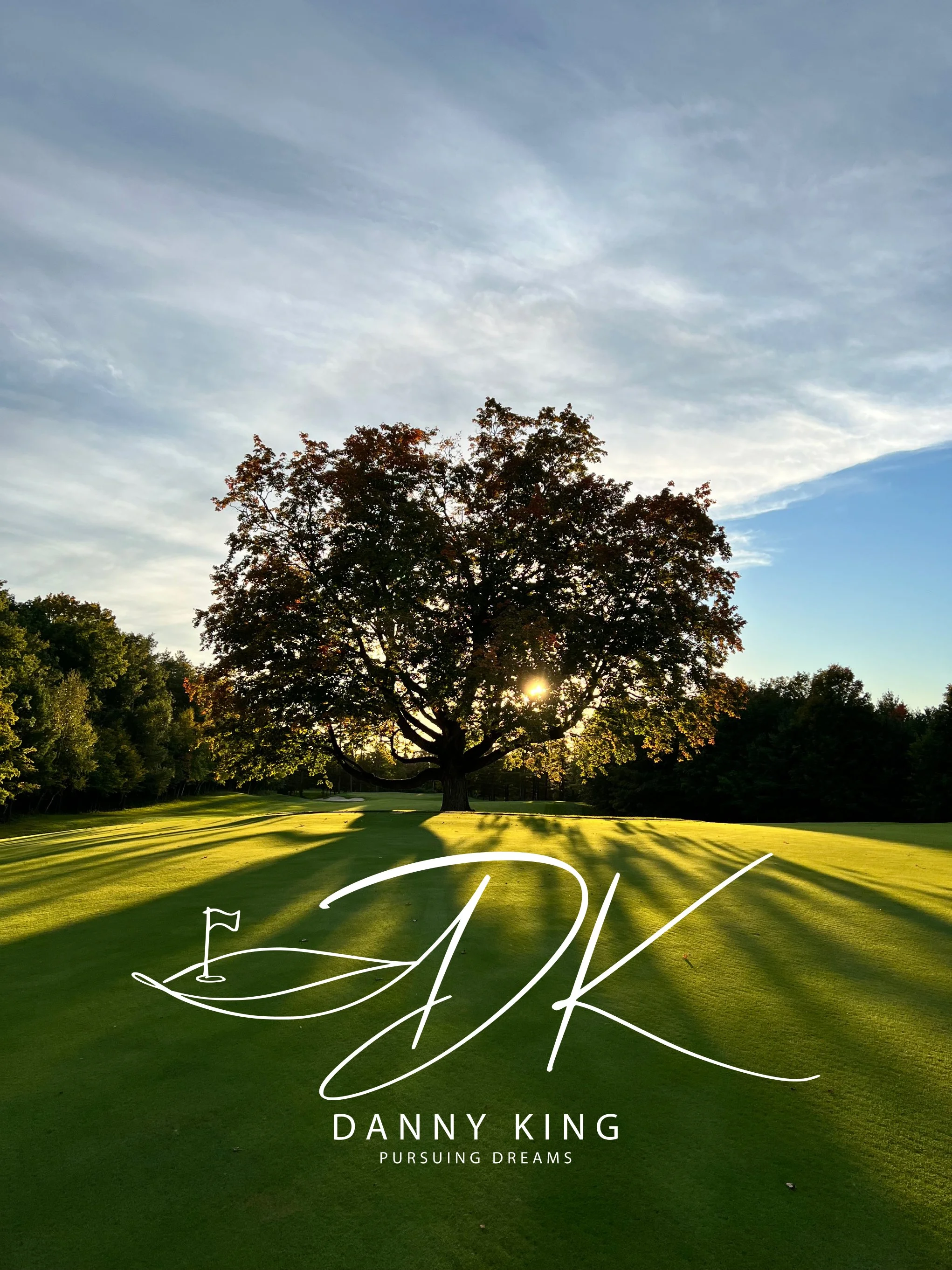 Sunset over a golf course with a large tree in the foreground and the sky partly cloudy. The image has overlaid white text that reads 'DANNY KING' and 'PURSUING DREAMS'.