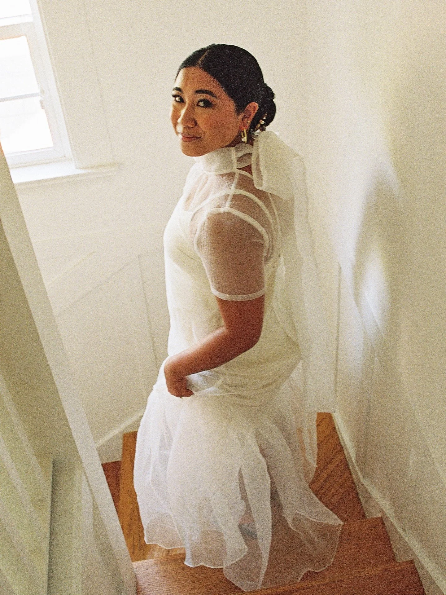 A glimpse into Elaine + Ethan&rsquo;s world 🫶🏻🌏

Getting ready at home in Oakland + a celebration with community at @piedmontcommunityhall.

@gobinggo.info 
@maiden.flora 
@understoryoakland 

Dev + scan @richardphotolab