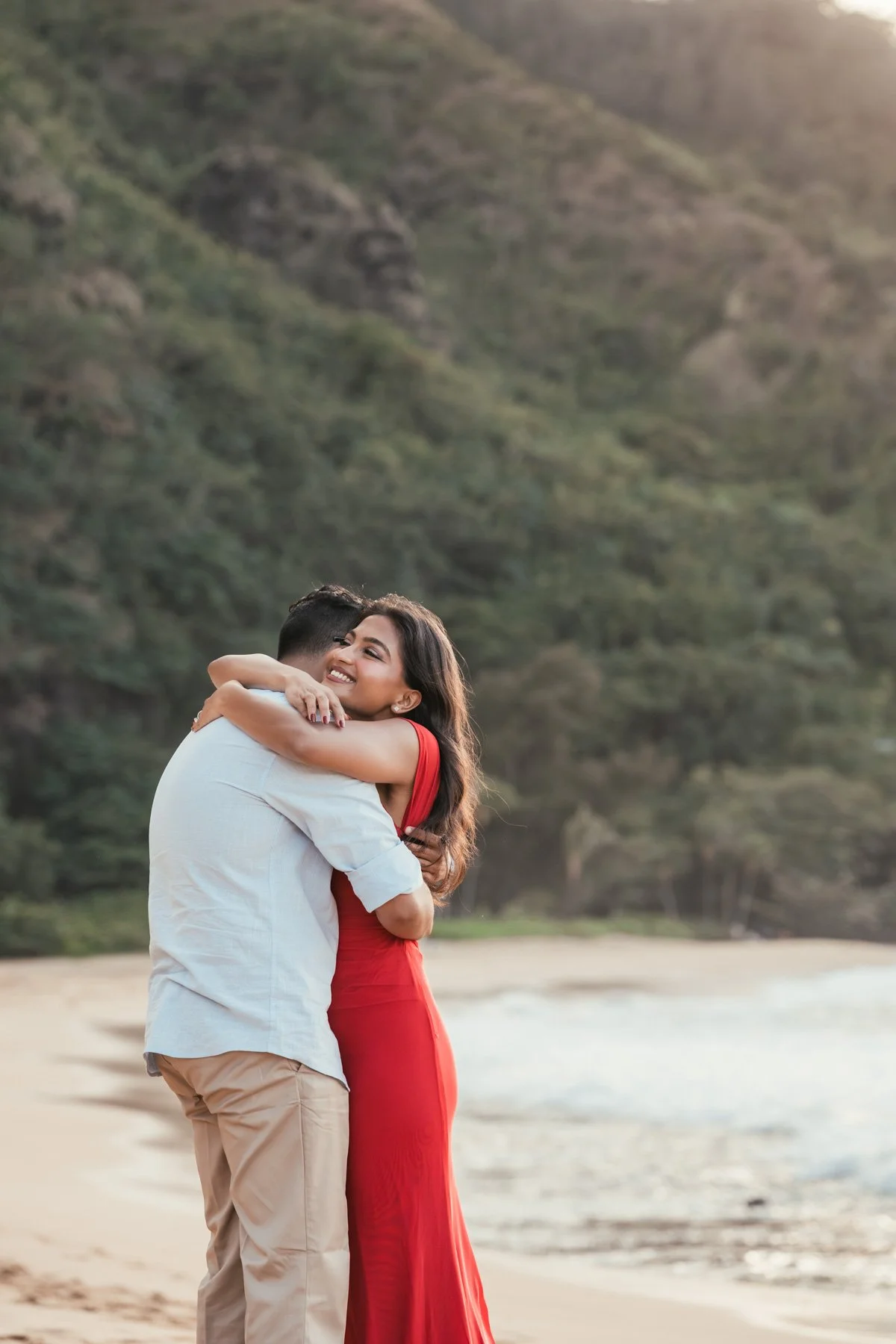 couple embraces after surprise proposal
