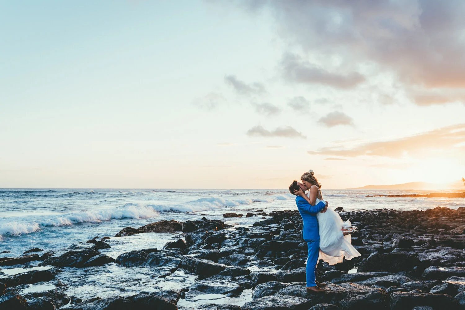bride and groom embracing during sunset at the Sheraton Kauai Resort