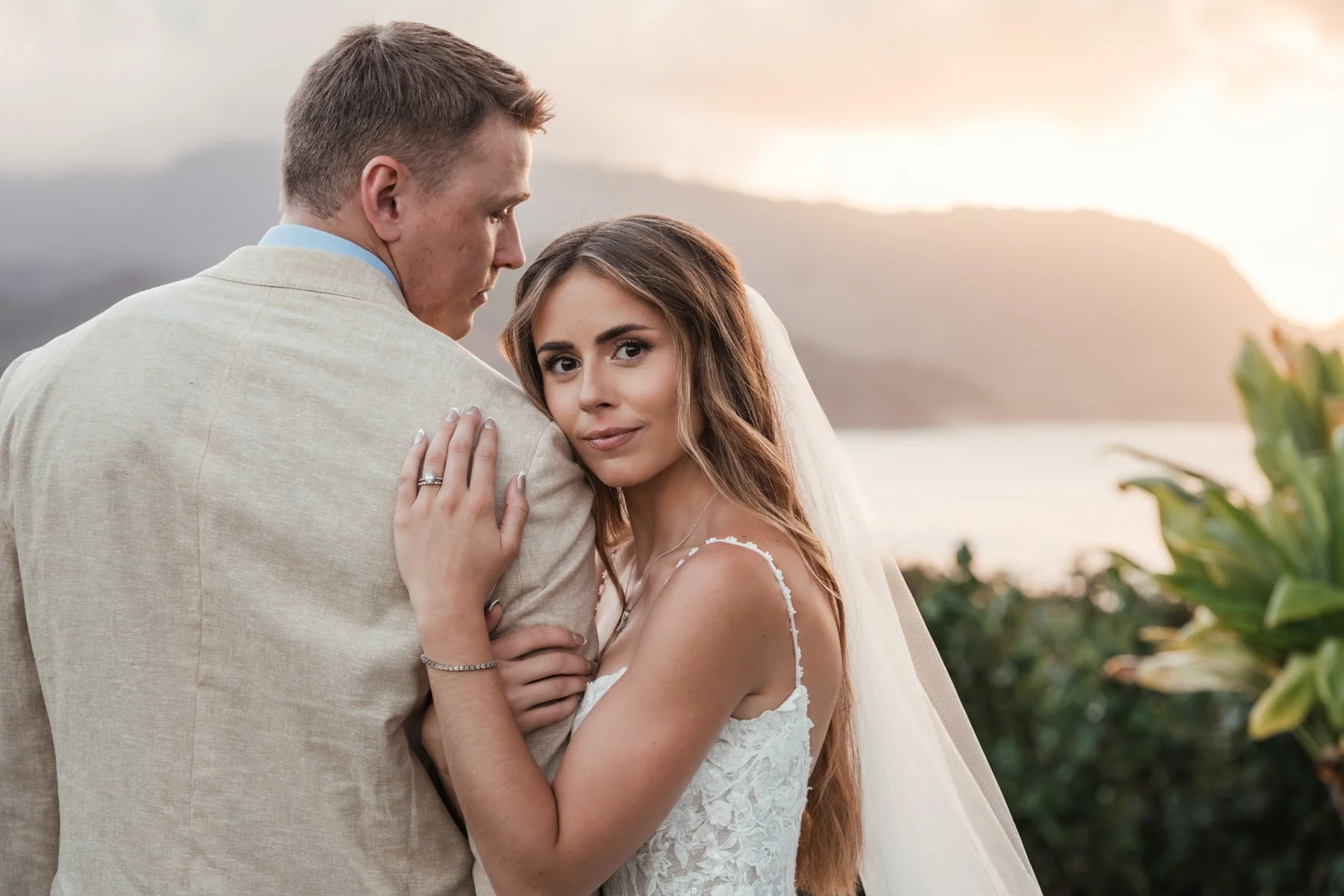 Bride holding Groom in Princeville after wedding ceremony on Kauai