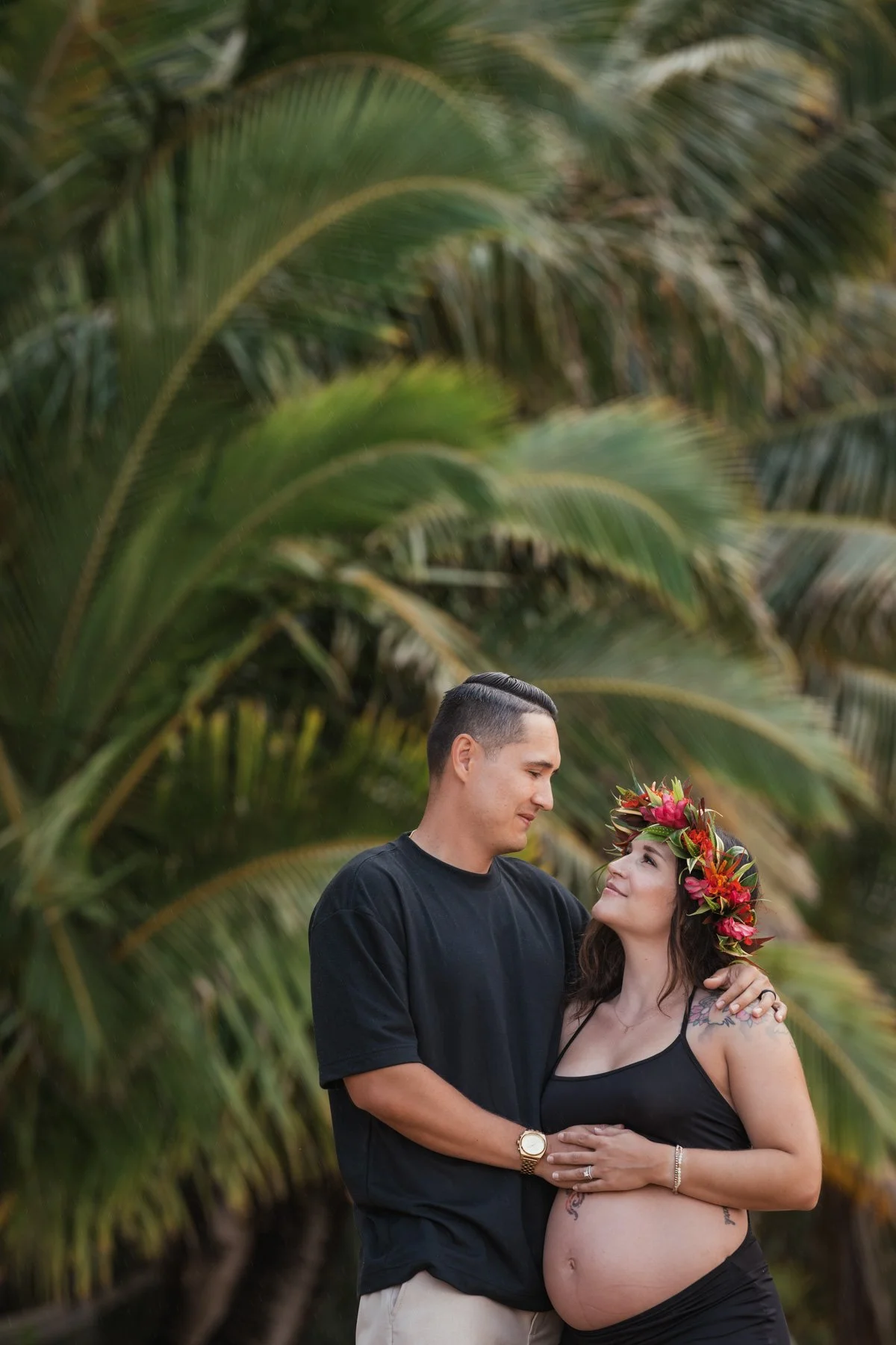 Maternity photography of expecting mother and father in jungle of Kauai