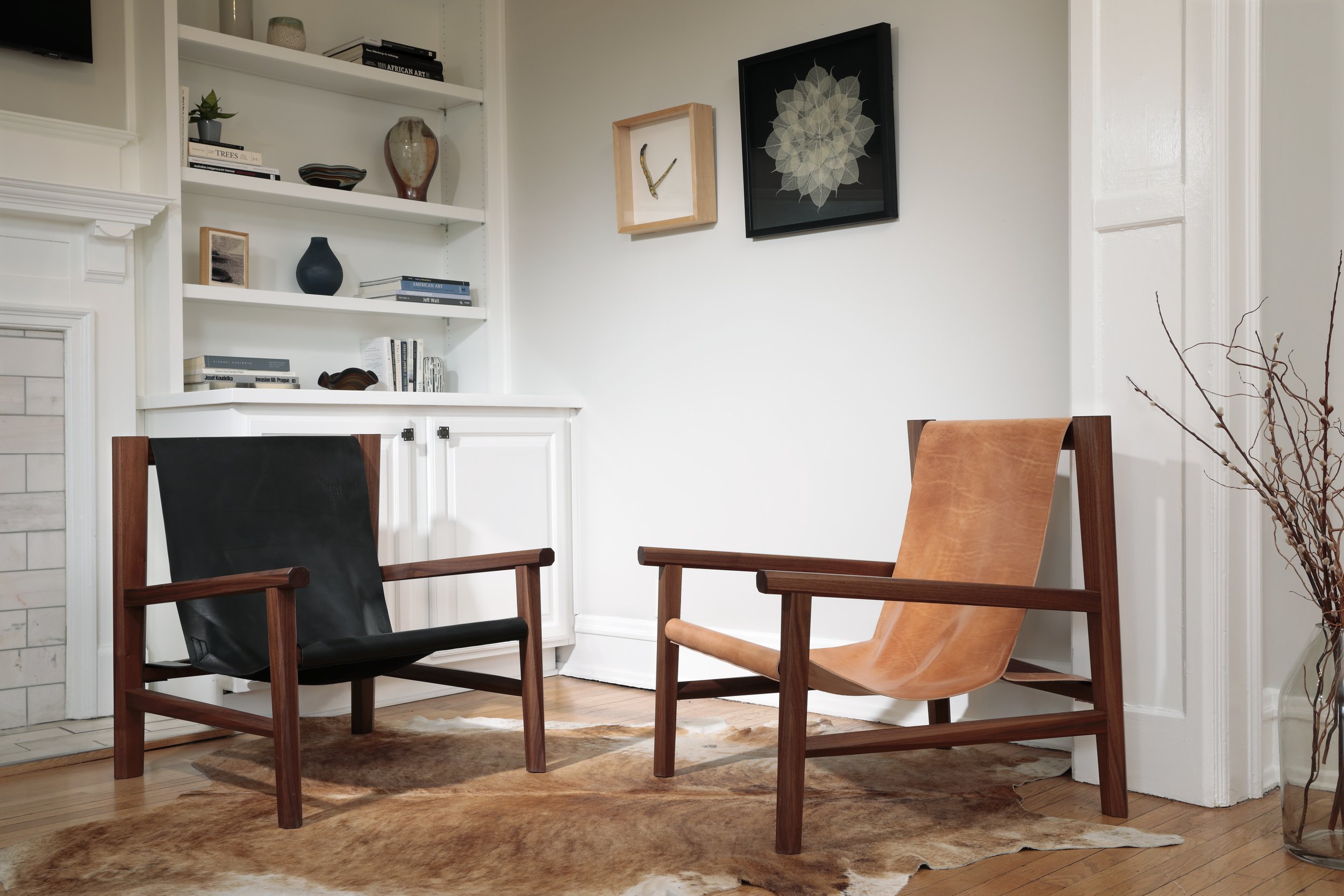 Combining the warmth of wood and the luxury of leather, this sling chair is the perfect place to spend an evening of relaxation. A collaboration between Alicia Dietz Studios and Awl Snap Leather, both women-owned business in Richmond, VA. A low and d