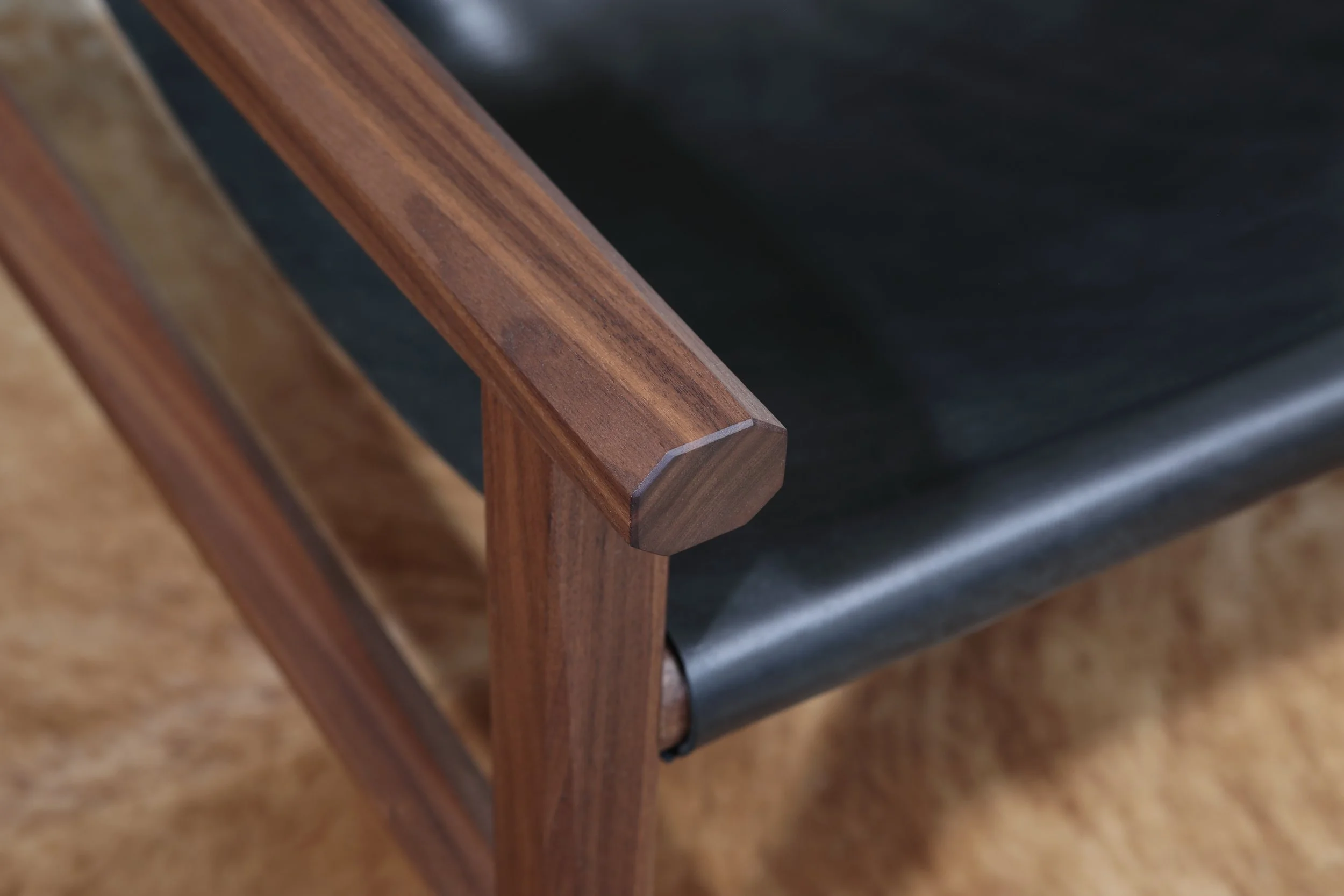 Combining the warmth of wood and the luxury of leather, this sling chair is the perfect place to spend an evening of relaxation. A collaboration between Alicia Dietz Studios and Awl Snap Leather, both women-owned business in Richmond, VA. A low and d