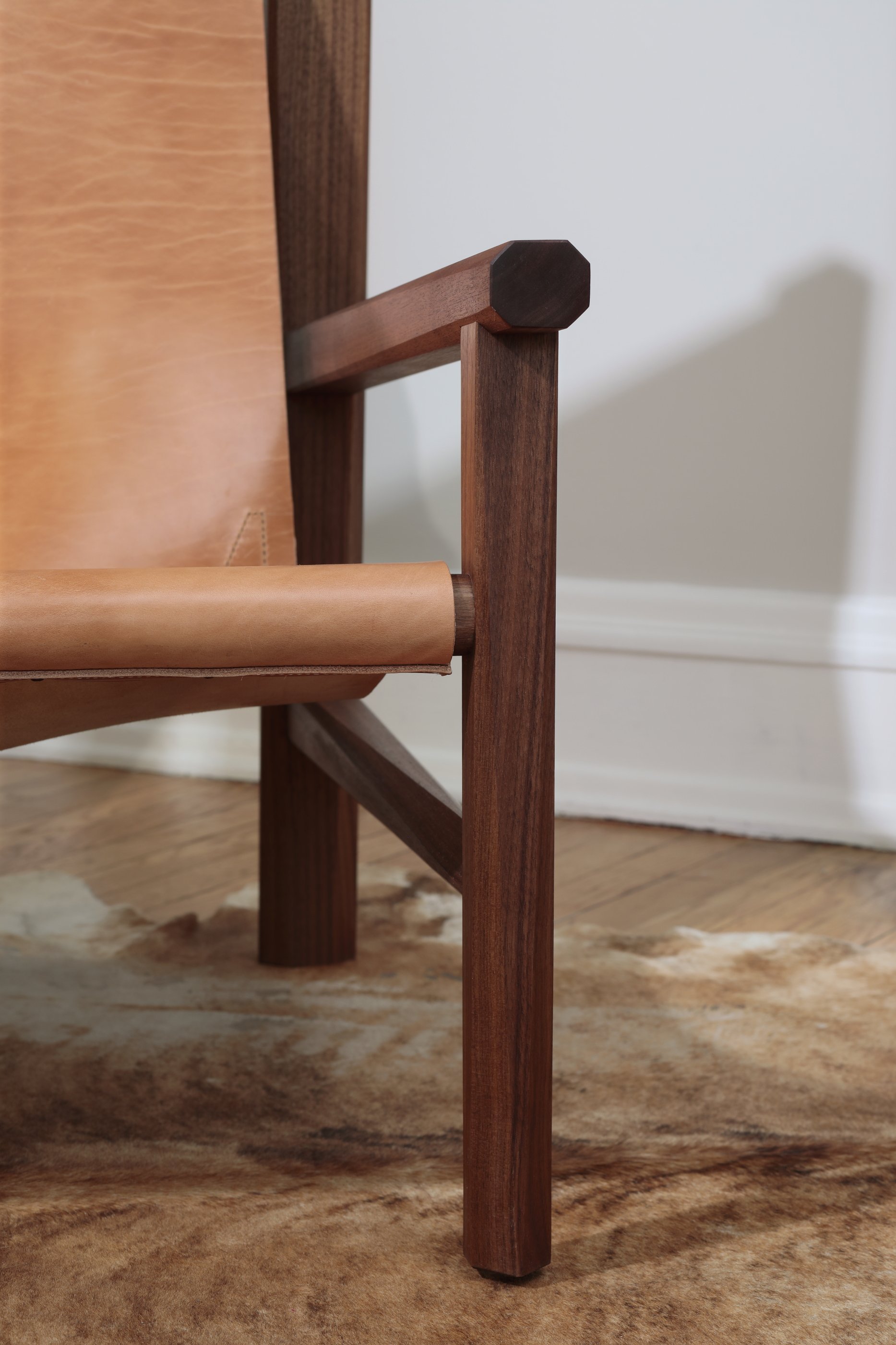 Combining the warmth of wood and the luxury of leather, this sling chair is the perfect place to spend an evening of relaxation. A collaboration between Alicia Dietz Studios and Awl Snap Leather, both women-owned business in Richmond, VA. A low and d