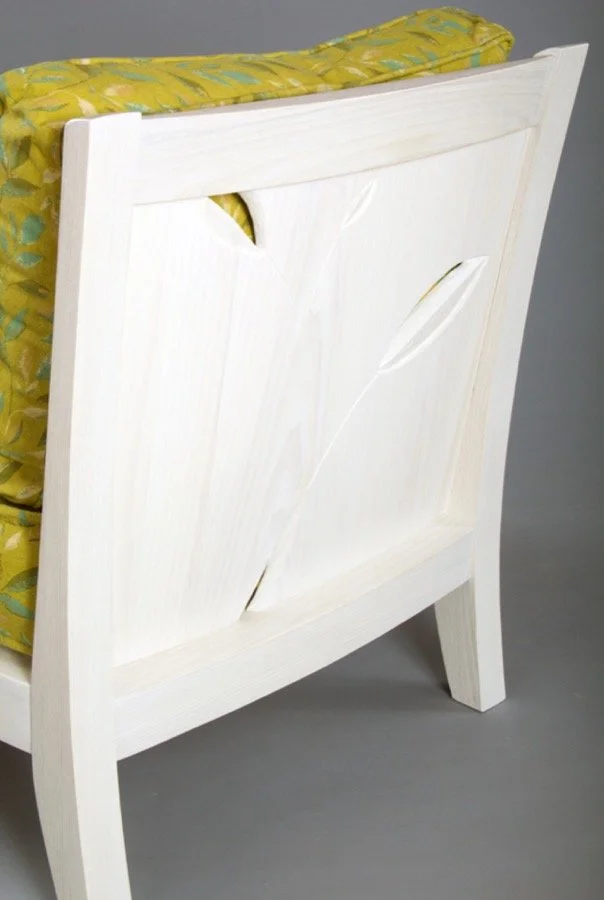 Custom Carved Wood Accent Sitting Chair. The low and wide profile of this reading chair allows you to kick back and snuggle up with a good book on a lazy Sunday morning. Coopered back panels give the backrest a subtle and comfortable curve. The work 