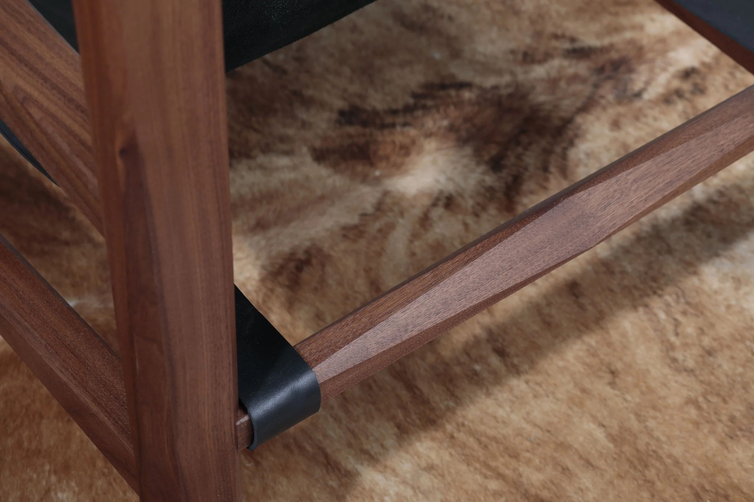 Combining the warmth of wood and the luxury of leather, this sling chair is the perfect place to spend an evening of relaxation. A collaboration between Alicia Dietz Studios and Awl Snap Leather, both women-owned business in Richmond, VA. A low and d