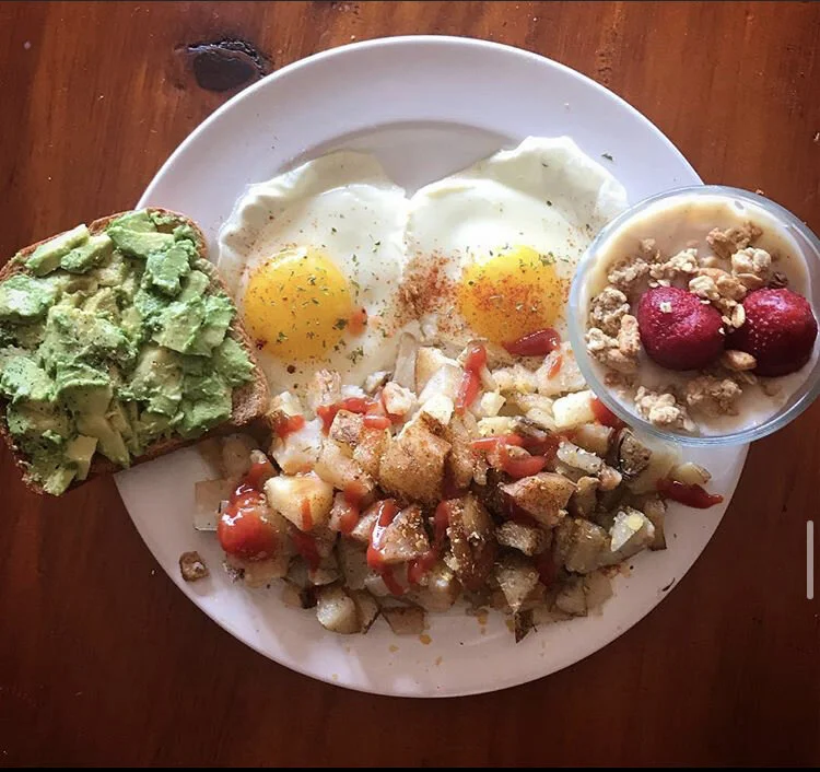 Heart Breakfast - Sunny Side Up Eggs sprinkled with Parsley & Paprika. Avocado Toast with a dash of pepper. Potatoes seasoned with some Basil & nutritional Yeast. A Parfait composed of dairy free Vanilla Yogurt with Kiwi, Mango, Raspberries, strawber