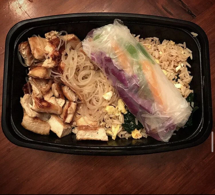Fried Tofu & rice noodles in a plum sauce, fried rice with spinach & egg, and  a homemade spring roll filled with purple cabbage, green & orange bell peppers, carrots & noodles  