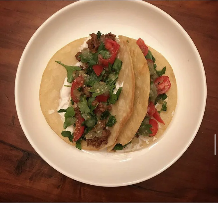 (Vegan) Fried Tortilla Shells, soy protein crumbles, vegan cheddar, dairy free sour cream, cherry tomatoes, spinach, cilantro, & salsa verde 