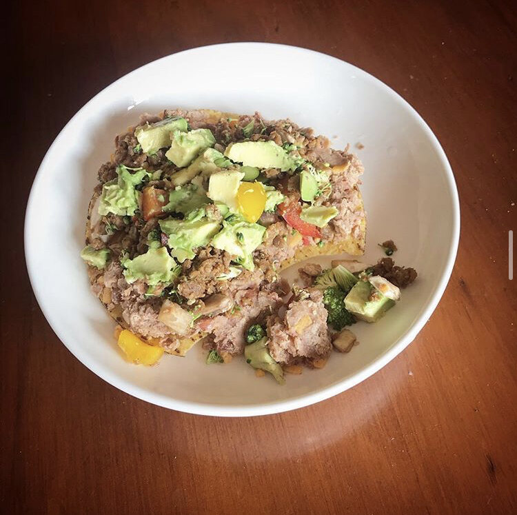 Tostadas with Refried beans, fresh avocado, juicy bell peppers, and broccoli bits