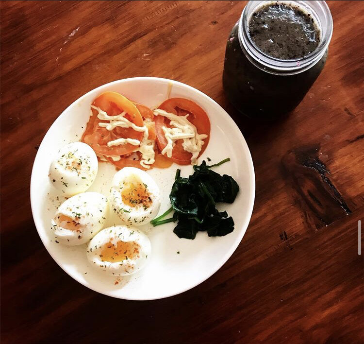Medium boiled Eggs, sprinkled with parsley & paprika, sautéed spinach, & sautéed tomatoes with a little vegan cheese. Paired with a Spinach, Pineapple, & Banana Smoothie 