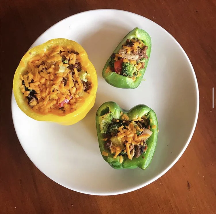 Stuffed Bell Peppers with, broccoli, vegan meat  crumbles, bell pepper bits, & vegan cheddar tossed in the oven for 15 minutes @ 350 degrees