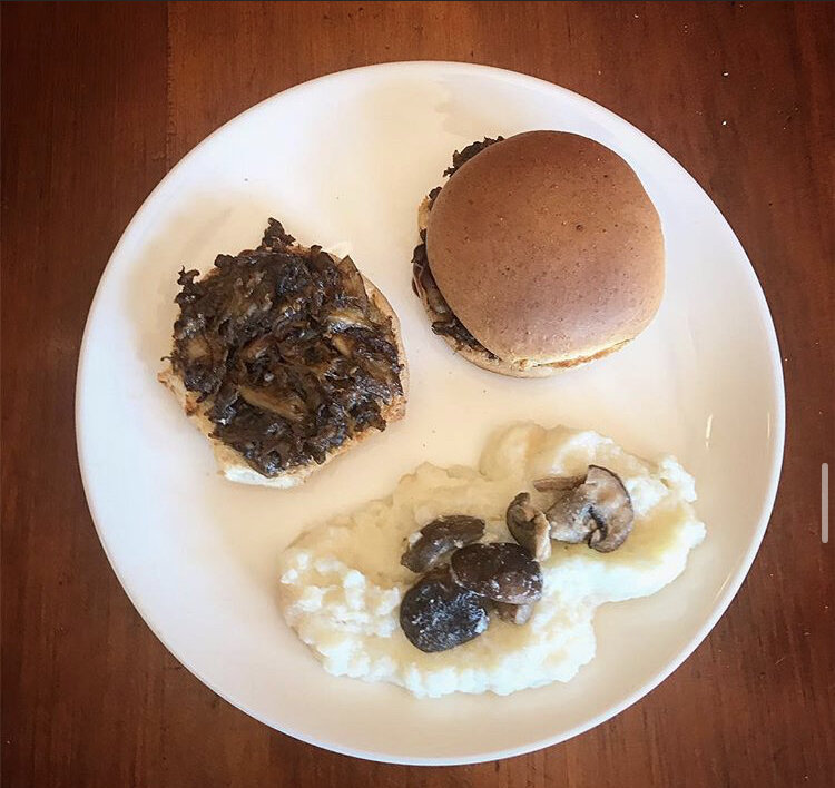 Pulled "Pork" (Mushrooms) BBQ sandwiched, served with a side of mashed potatoes, and sautéed mushrooms 