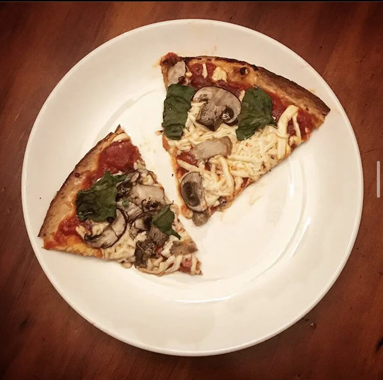 homeade pizza, Mushrooms, vegan cheese, basil, rats marinara sauce, and some fresh picked oregano 
