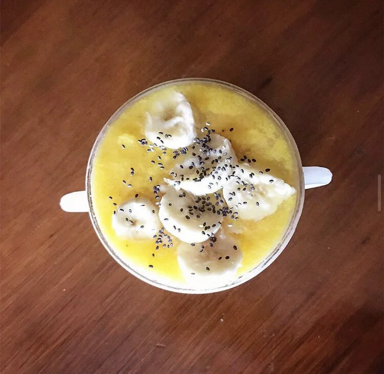 Mango Banana & Turmeric Smoothie, topped with Chia seeds & Fresh Banana Slices