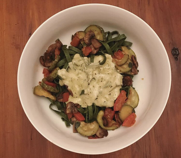 Creamy Alfredo Pesto Pasta, using spinach noodles, mushrooms, zucchini, & tomatoes