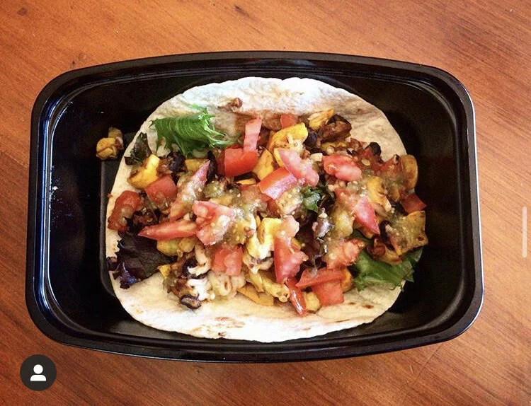 Burrito featuring: Squash, Tomatoes, Black Beans, Vegan Cheese, Spring Mix Lettuce, Soyrizo, & Lime 