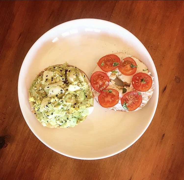1/2 Bagel with Avocado, Hard Boiled Egg, everything Bagel Seasoning & squirt of lime. 1/2 bagel with Vegan cream cheese, cherry tomatoes, pepper, and fresh oregano from the garden. 