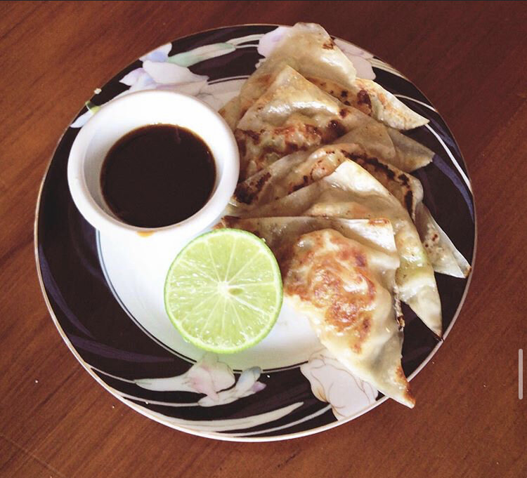 Home-made Dumplings with Ponzu Sauce - Dumplings filled with - Tofu, Cabbage, Carrot, Onion, Garlic, Pepper, Sesame Oil, a plash of Soy Sauce, & Lime 