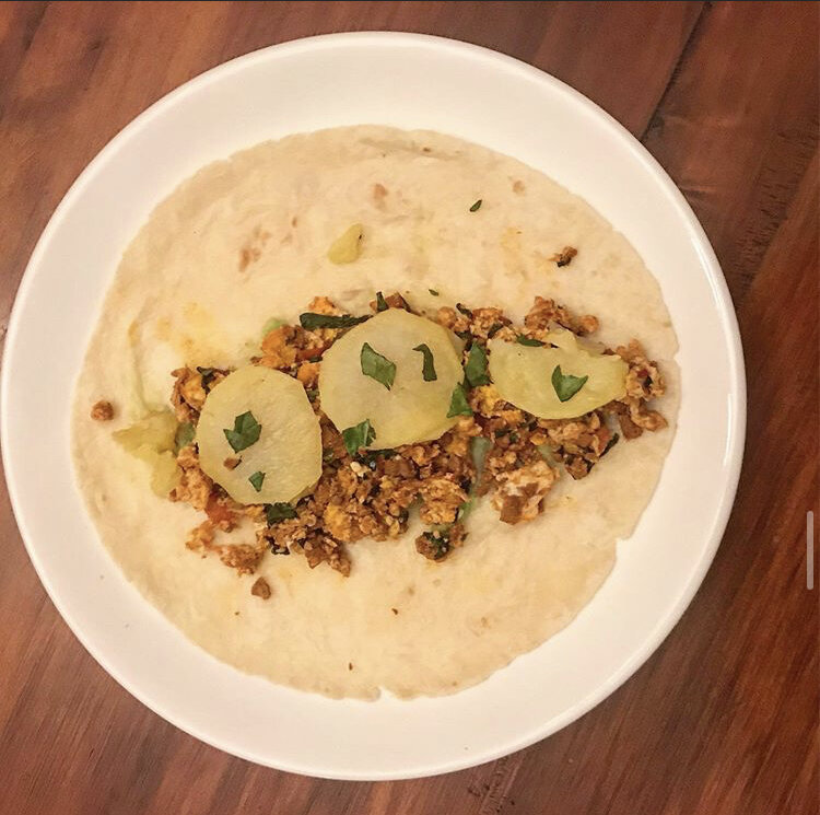 Soyrizo potato burritos, egg, soyrizo, potatoes, spinach, dairy free cheese, tomatoes, and avocado 