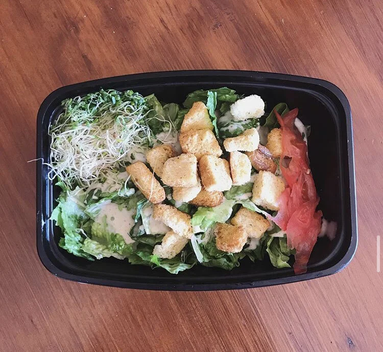 Caesar Salad - romaine Lettuce, vegan cases, croutons, sprouts, tomatoes 