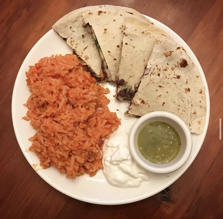 Quesadilla & mexican rice with green salsa and sour cream - inside the quesadilla: dairy free cheese, avocado, and refried black beans  paprika, cumin, onion powder, garlic powder, and cayenne pepper