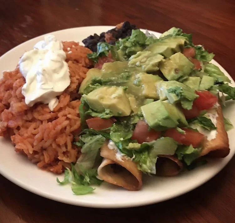 Mushroom Taquitos, mexican rice, refried beans, tomatoes, avocado, salsa, sour cream 
