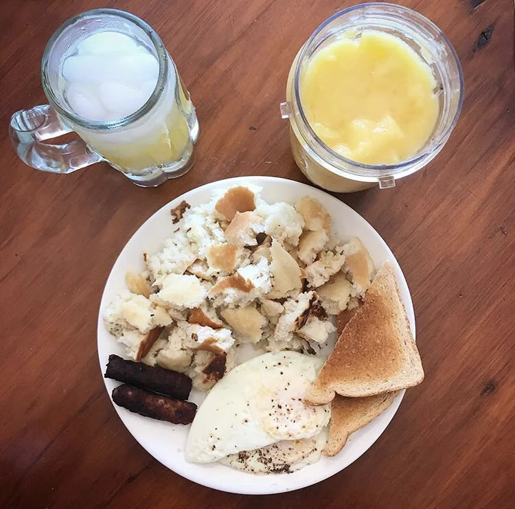 Pancakes, over medium eggs, 2 sausages, slice of toast, pineapple/mango smoothie, and a mimosa 
