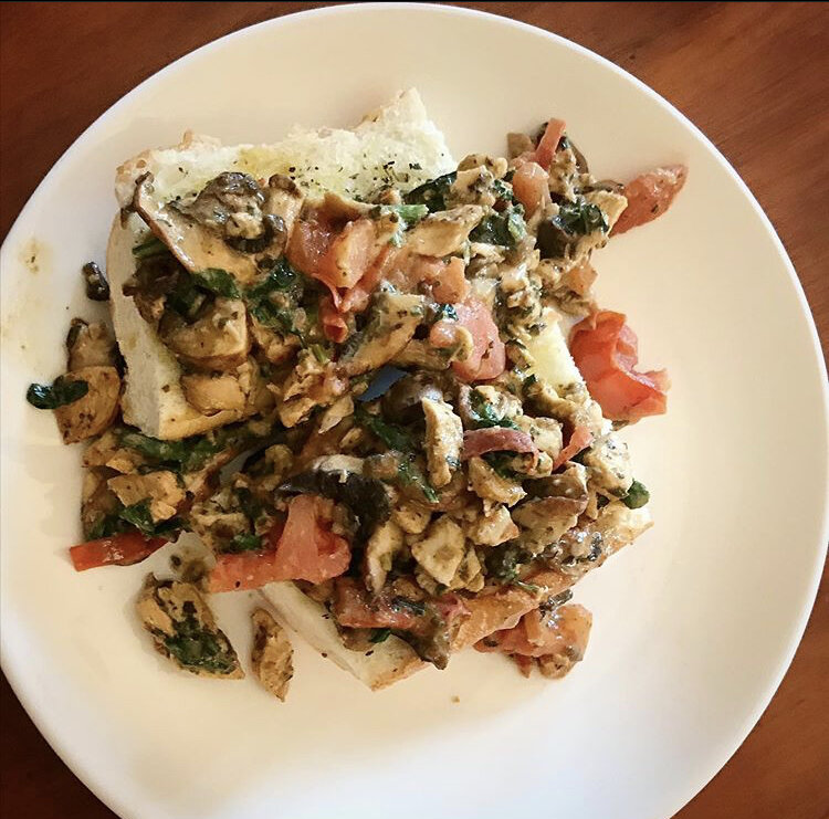 French Bread Halved & served open face, with tomatoes, cheese, spinach, mushrooms, chicken