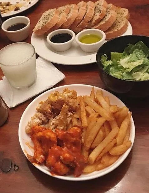 Vegan Hot Wings- Buffalow Cauliflower wings, with fries, caesar salad, and garlic bread