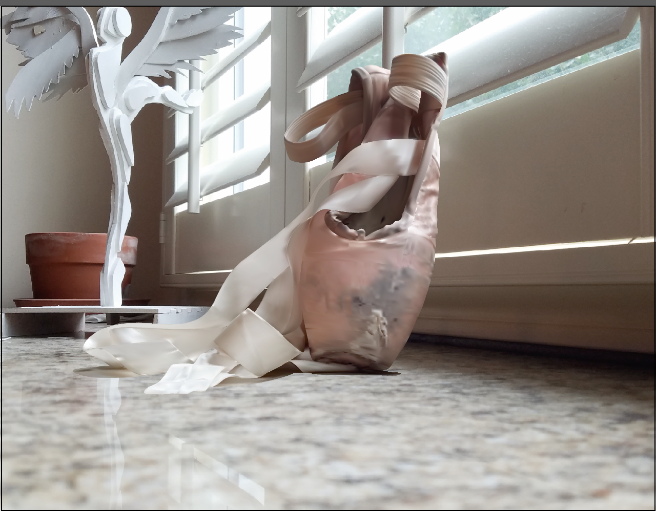 Old Shoes, the background is a photograph, while the shoes were created in Adobe Illustrator and the placed in the photo afterwards.