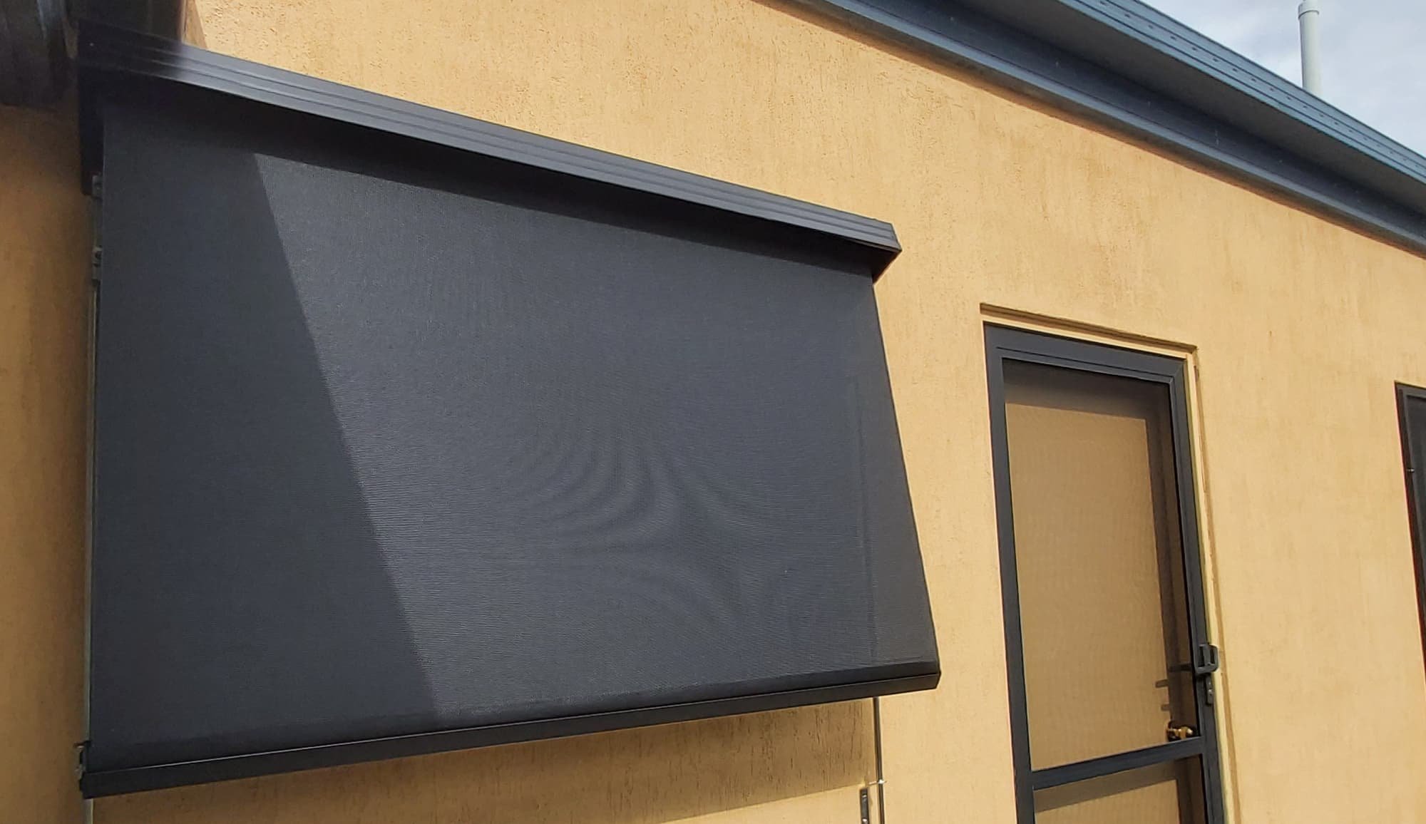 betta-2000-lock-arm-awning-installed-on-mediterranean-home.jpg