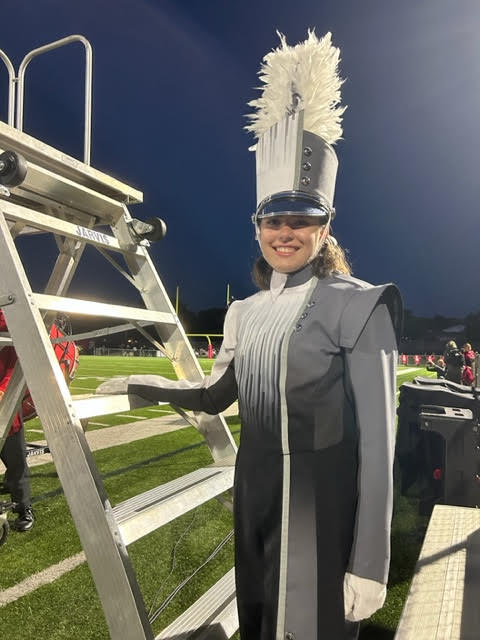 Lehner beside the drum major podium.