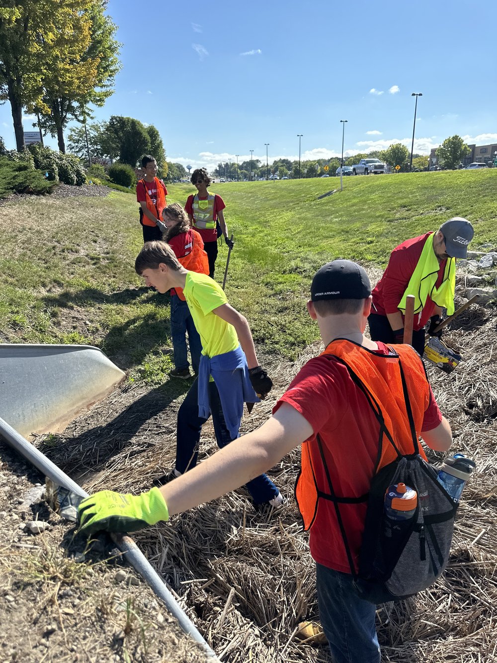 Team members clean up Wisconsin roads at the Adopt-a-Highway event.