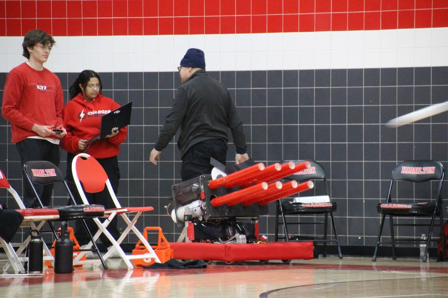 Chargers run the T-shirt cannon at a basketball game to promote STEM.